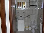Bathroom in Hotel Pontis - rooms and apartments in Biatorbagy - cheap hotel
